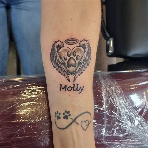small angel memorial tattoo.
